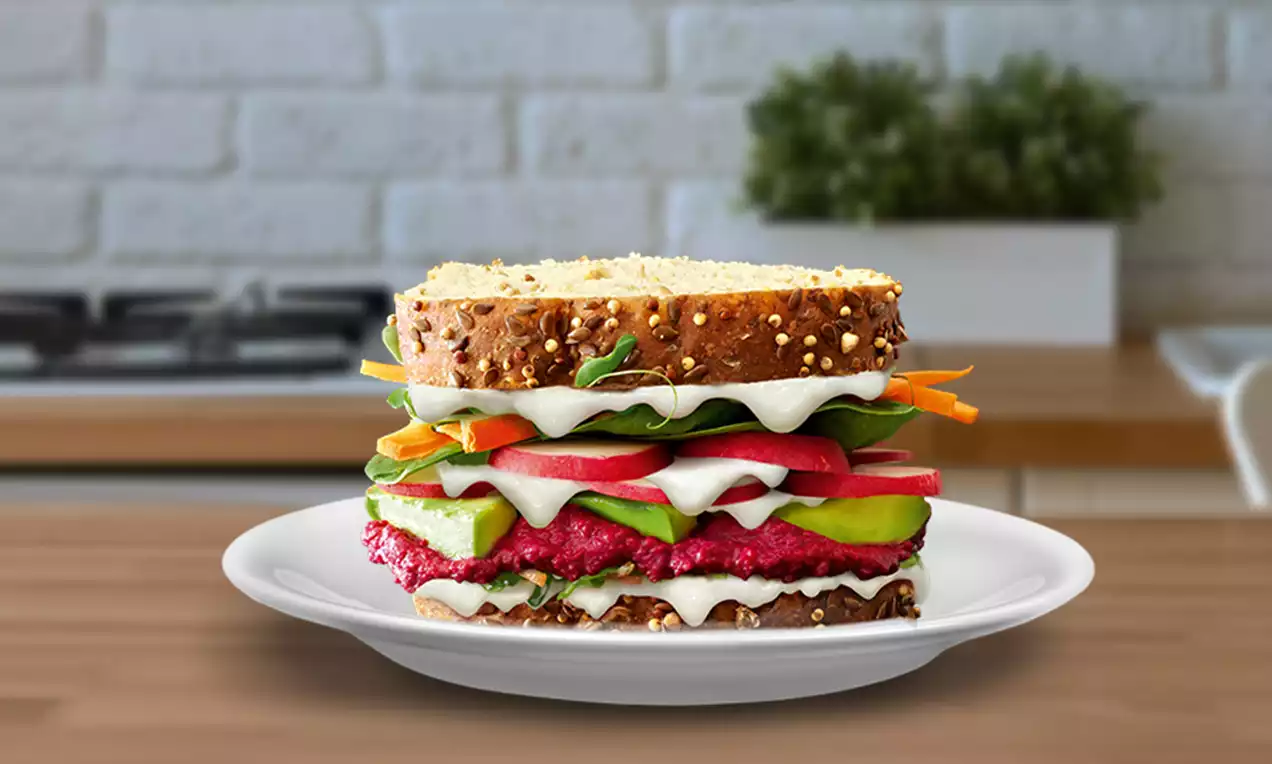 multigrain sandwich with beetroot avocado and greens